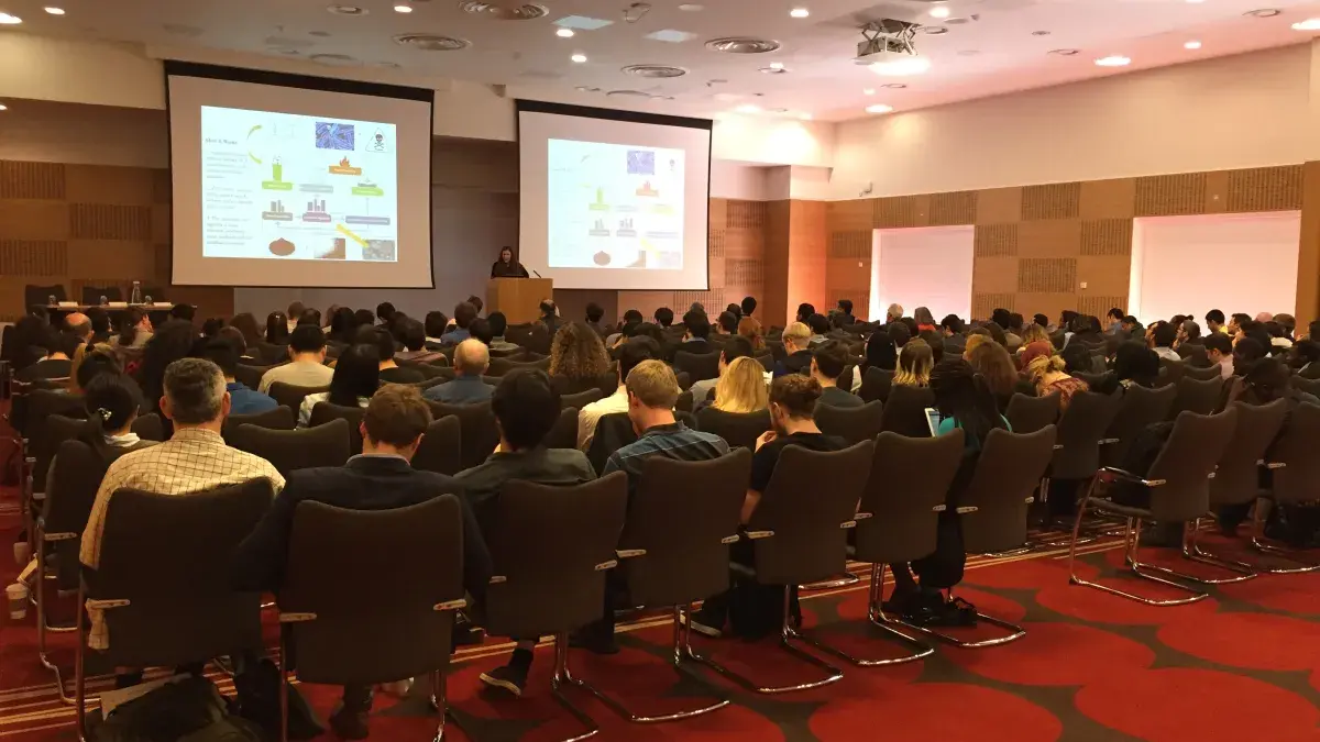 View from the back of a lecture theatre towards speaker giving a talk School of Engineering Research Conference
