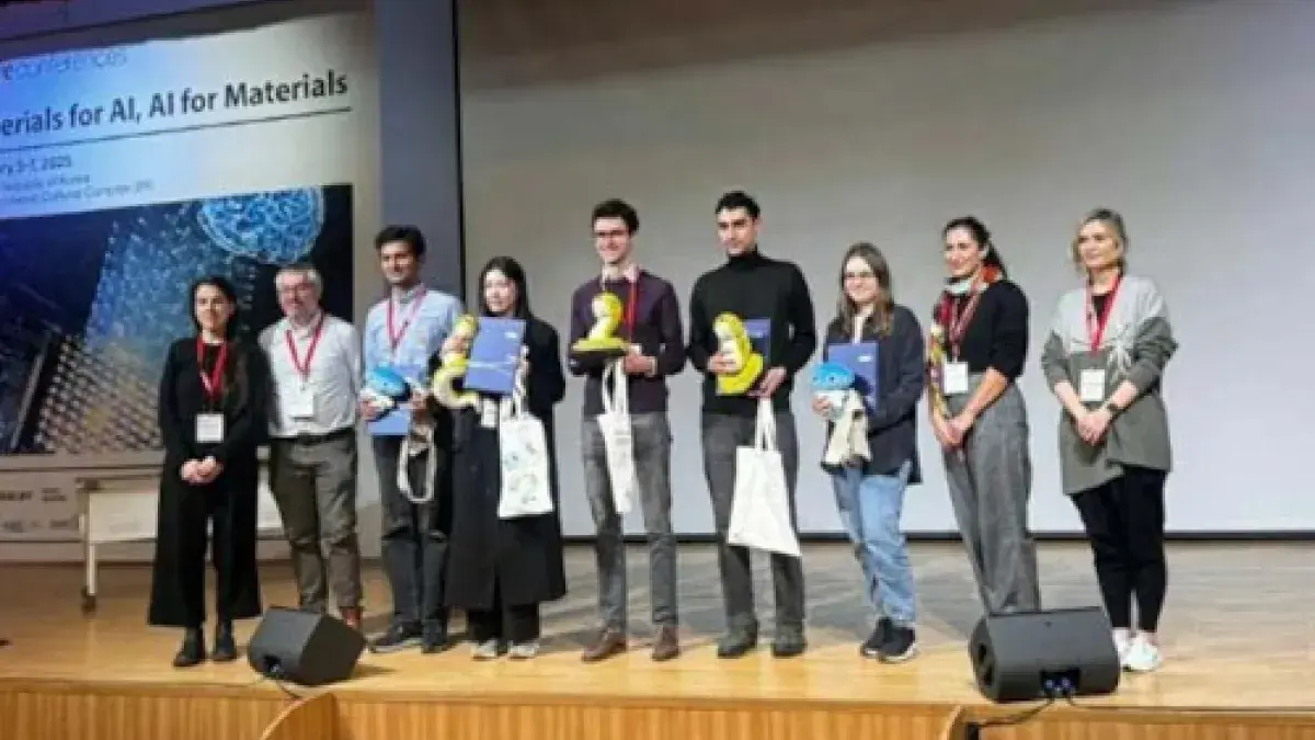 CEF students on stage receiving awards at the school of engineering postgraduate research conference
