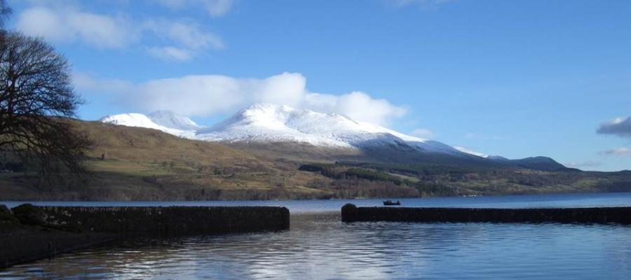 Loch Tay with a snowy Ben Lawers and blue sky in the background