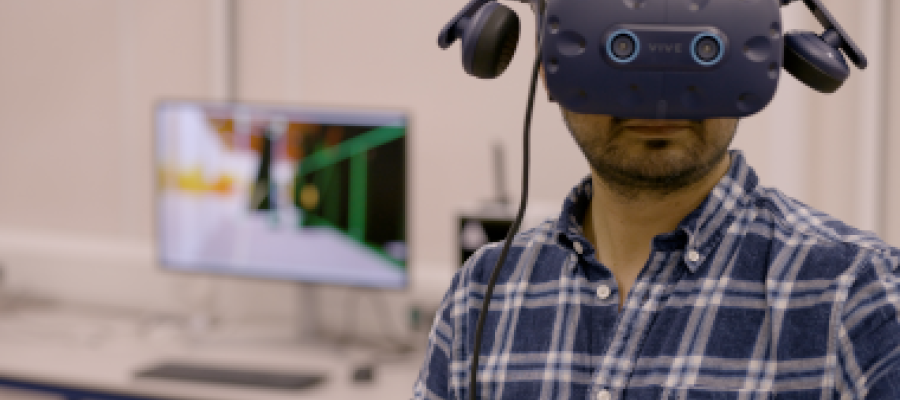 Engineering researcher wearing a VR headset in a laboratory