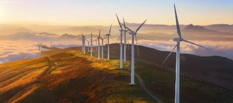 Mechanical Engineering panel image showing wind turbines on top of a mountain