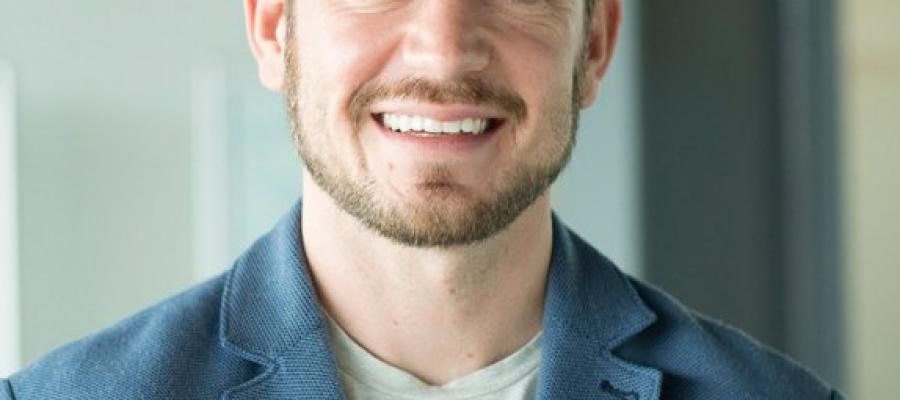 Robert Shepherd profile photograph, smiling and wearing light blue jacket