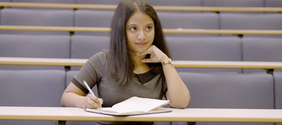 Postgraduate engineering student in a lecture theatre