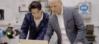 postgraduate engineering student under supervision in a laboratory