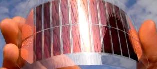 Energy harvesting technology held in a hand with blue sky in the background