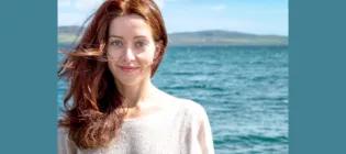 alyona naberezhnykh, with blue sea and sky in background