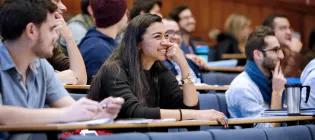 Smiling Engineering students in a lecture theatre