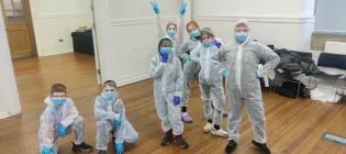 Group of Primary School children dressed in safety gear attending an Engineering outeach event