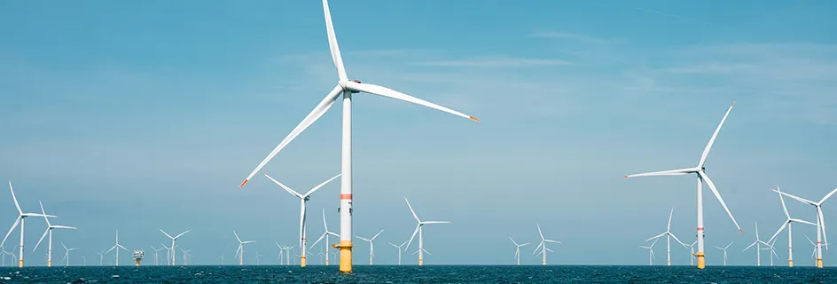 Wind turbines at sea. || Wave-predicting robots could cut green energy costs