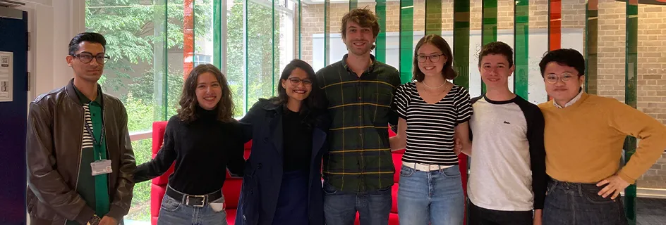 School of Engineering student interns group photo standing together in the Eng Inn || Summer interns deliver lightning presentations 