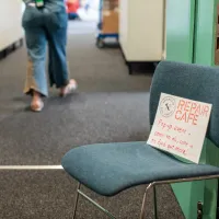 Photo of chair with repair cafe event signage