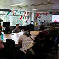 Users at listening to a technician in a workshop