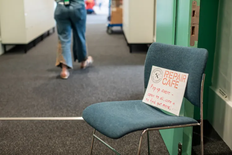 Photo of chair with repair cafe event signage