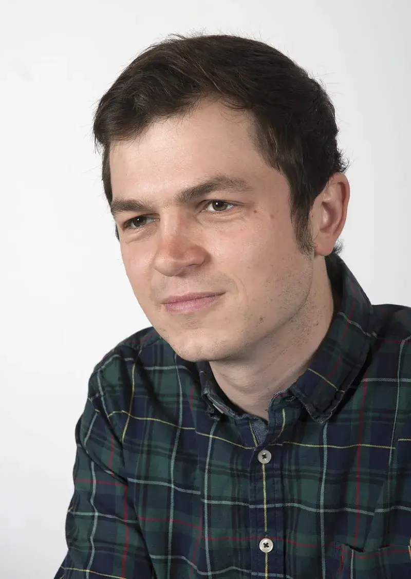 portrait photo of Chris Ness wearing checked shirt