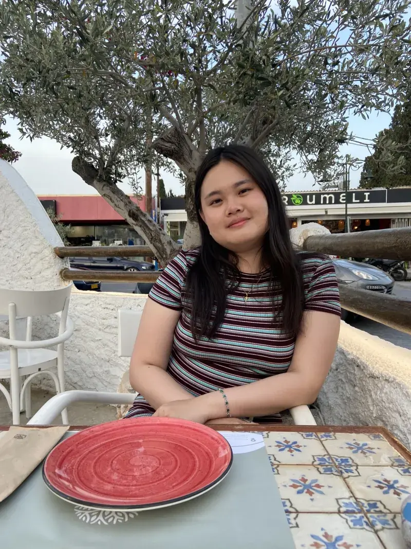 Christine Loo Jin Ai sitting in a cafe