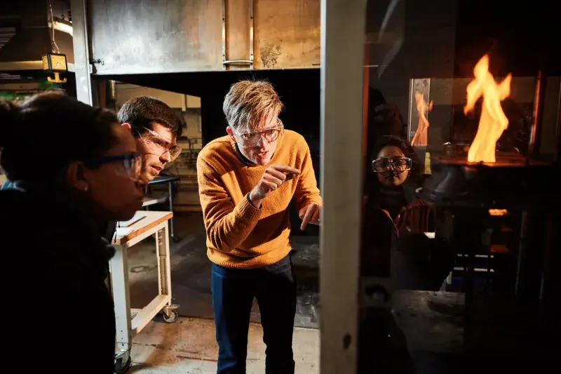 Professor Rory Hadden demonstrating a fire experiment.