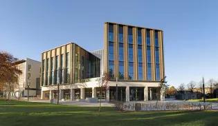 A wide angle photograph of the Nucleus Building within King's Building campus at the University of Edinburgh
