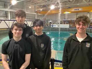 A group of school pupils stood in front of the wave tank.