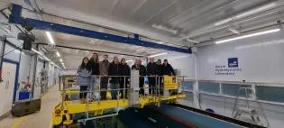 IDCORE staff and students standing above the Kelvin Hydrodynamics Laboratory in the University of Strathclyde