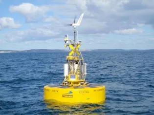 South West Mooring Test Facility - a yellow buoy out at sea in Falmouth Bay, Cornwall, UK