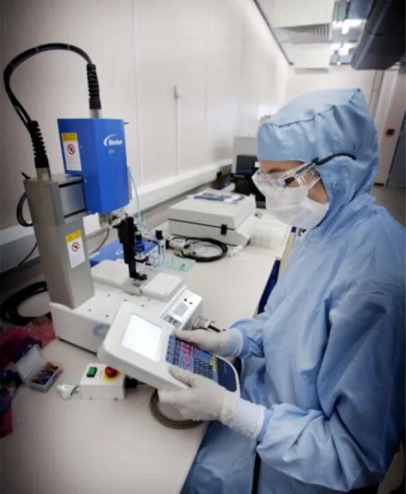 Research student working in the SMC clean rooms