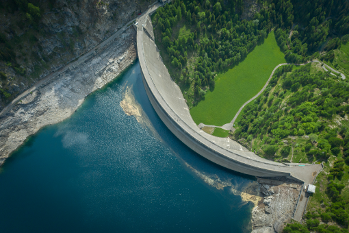 Civil and Environmental Engineering panel image showing a dam and reservoir from above