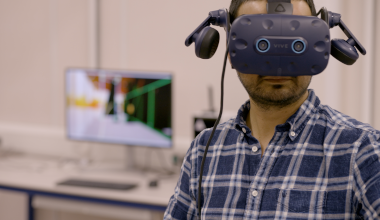 Engineering researcher wearing a VR headset in a laboratory