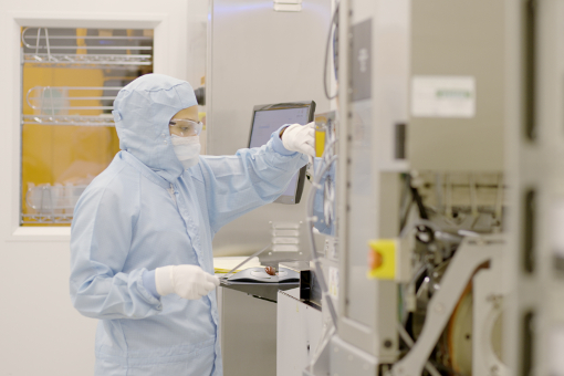 Engineering researcher working in a cleanroom