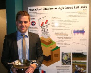 David Connolly with the Scottish Geotechnical Group poster presentation cup