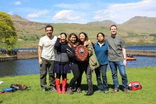 Researchers from the Institute for Materials and Processes dressed casually for outdoor spring activities with Loch Tay and Ben Laters behind them