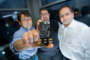 Professor Tughrul and co-founders of Sofant Technologies show off their latest research development