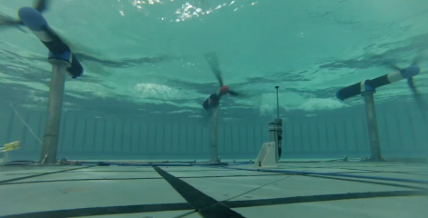 An underwater photo of tidal turbines within the Flowave Ocean Energy Research facility at the University of Edinburgh