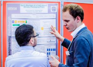 Chemical Engineering student discussing Industrial placement project poster